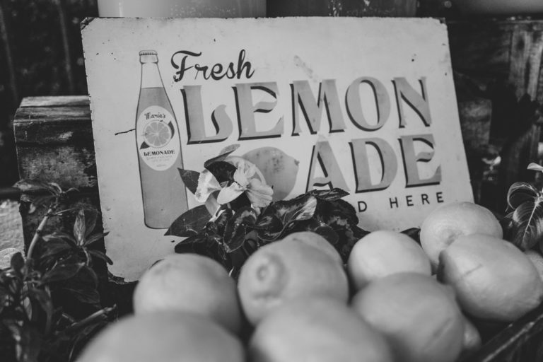 Photo of Lemons Piled Up on a Lemonade Stand